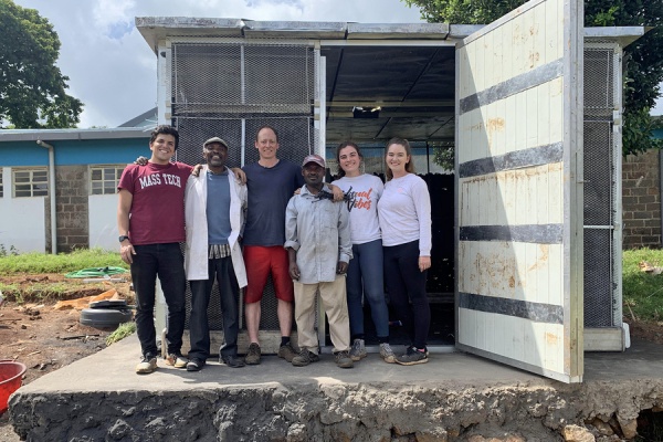 PI's and researchers  in front of shipping container