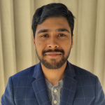 Headshot of Akash Ball in front of a yellow background